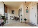 Cozy screened porch with seating and plants at 6472 Seagull Dr # 303, Bradenton, FL 34210