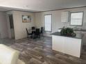 Open kitchen with island and dining area at 7337 Desant Ln, Port Charlotte, FL 33981