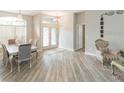 Elegant dining room with a chandelier and hardwood floors at 23635 Oakside Blvd, Lutz, FL 33559