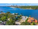 Aerial view of waterfront property, showcasing the house and surrounding area at 2 Brightwaters Ne Cir, St Petersburg, FL 33704