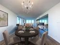 Elegant dining room with hardwood floors and a chandelier at 220 Belleview Blvd # 609, Belleair, FL 33756