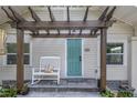 Inviting front porch with a rocking chair and pergola at 236 9Th Ne Ave, St Petersburg, FL 33701
