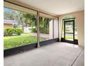 Spacious screened porch overlooking backyard at 4347 Great Lakes N Dr, Clearwater, FL 33762