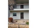 Condo building exterior showing entrance and landscaping at 5197 Silent Loop # 121, New Port Richey, FL 34652