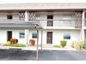 Condo building exterior showcasing parking and entrance at 5197 Silent Loop # 121, New Port Richey, FL 34652