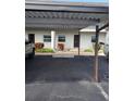 Covered parking spot in front of condo building at 5197 Silent Loop # 121, New Port Richey, FL 34652