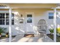 Inviting front porch with modern chair and stylish door at 5501 7Th N Ave, St Petersburg, FL 33710