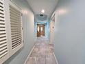 Light and airy hallway with tile floors and access to elevator at 555 5Th Ne Ave # 521, St Petersburg, FL 33701