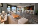 Spacious living room with water views, hardwood floors, and ample natural light at 555 5Th Ne Ave # 521, St Petersburg, FL 33701