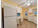 View of kitchen appliances and a small dining area at 1100 Belcher S Rd # 190, Largo, FL 33771