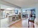 Open kitchen with stainless steel appliances and breakfast bar at 1111 Harefield Cir # 62, Sun City Center, FL 33573