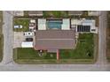 Top-down view of single-story home, pool, and surrounding structures at 12002 Washington St, Seffner, FL 33584