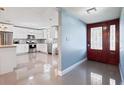 Modern kitchen featuring white cabinets, stainless steel appliances, and granite countertops at 1571 Jeffords St, Clearwater, FL 33756