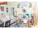 Bright living room featuring comfortable sofas and coastal-themed decor at 2297 Anchor Ave, Spring Hill, FL 34608