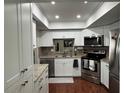 Modern kitchen with stainless steel appliances and granite countertops at 3053 Overlook Pl, Clearwater, FL 33760