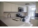 Kitchen boasts stainless steel appliances and light countertops at 3377 Fox Hunt Dr # B, Palm Harbor, FL 34683