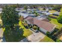 Aerial view of house, yard, and surrounding neighborhood at 4345 Union Springs Rd, Spring Hill, FL 34608
