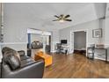 Open living space with hardwood floors, comfortable seating, and home office at 5715 20Th W St, Bradenton, FL 34207