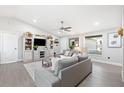 Spacious living room with gray sofas and built-in shelving at 6233 Florida E Cir, Apollo Beach, FL 33572