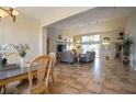 Spacious living room with tile floors and neutral colors at 6769 Greenview Ln, Englewood, FL 34224