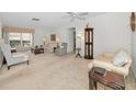 Spacious living room featuring ample natural light and comfy furniture at 8236 Brentwood Rd, Seminole, FL 33777