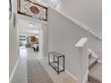 Bright and spacious entryway with staircase and view to living area at 9512 Lemon Drop Loop, Ruskin, FL 33573