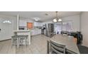 Kitchen features stainless steel appliances and dining area at 10107 N Arden Ave, Tampa, FL 33612