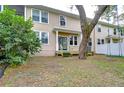 Townhome's private backyard with wooden deck and mature trees at 208 Elm View Ct, Brandon, FL 33511