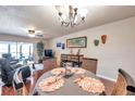 Bright dining area with round table and wicker chairs at 2700 Nebraska Ave # 3-201, Palm Harbor, FL 34684