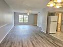 Bright living area featuring wood-look floors and lots of natural light at 314 Barlow Ave # 73, Sarasota, FL 34232