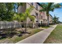 Townhouse exterior with sidewalk and lush landscaping at 3421 W Horatio St # 109, Tampa, FL 33609