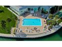 Community swimming pool with plenty of room for sunbathing and recreation at 400 64Th Ave # 502, St Pete Beach, FL 33706