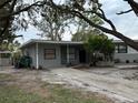 House exterior showcasing a front yard and driveway at 4108 W Oakellar Ave, Tampa, FL 33611