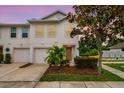 Attractive two-story townhome with garage and front yard lighting at 4533 Ashburn Square Dr # 4533, Tampa, FL 33610