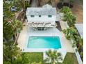 Aerial view showing house, pool, and lush landscaping at 5816 Woodrow Wilson Ne Blvd, St Petersburg, FL 33703