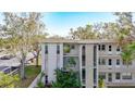 Side view of the condo building showcasing its architectural details and landscaping at 5890 38Th N Ave # 101, St Petersburg, FL 33710