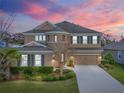 Beautiful two-story home featuring manicured lawn and attached two-car garage at 6307 Brevada Ln, Apollo Beach, FL 33572