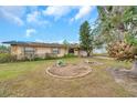 Landscaped front yard with a single-story house and attached garage at 6327 5Th Street E Cir, Bradenton, FL 34203