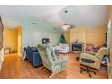 Living room with hardwood floors and a fireplace at 6931 Silvermill Dr, Tampa, FL 33635