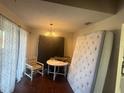 Small dining area with a table and chairs, and a mattress at 7724 St Andrews Blvd, Weeki Wachee, FL 34613