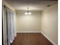 Dining room with chandelier, and hardwood floors at 7724 St Andrews Blvd, Weeki Wachee, FL 34613