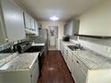 Modern kitchen featuring stainless steel appliances and granite countertops at 7724 St Andrews Blvd, Weeki Wachee, FL 34613