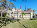 Two-story house with a large yard and palm trees at 8811 Casablanca Way # 106, Tampa, FL 33626