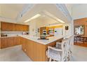 Large kitchen with island and wood cabinets at 9144 Highland Ridge Way, Tampa, FL 33647