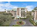 Condo building exterior showcasing landscaping and circular driveway at 1002 S Harbour Island Blvd # 1502, Tampa, FL 33602