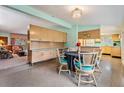 Bright dining area with kitchen views and vintage table at 11012 N Oregon Ave, Tampa, FL 33612