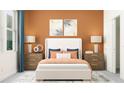 Bright bedroom with a white bed and orange accents at 11874 Sparkling Topaz Cv, Parrish, FL 34219