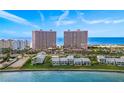 Aerial view of luxurious beachfront twin towers and adjacent buildings at 1310 Gulf Blvd # 4-G, Clearwater, FL 33767