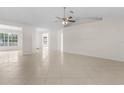 Spacious living room with tile floors and high ceilings at 1360 Franklin Ln, North Port, FL 34286