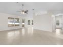 Open living space with tile floors and access to backyard at 1360 Franklin Ln, North Port, FL 34286